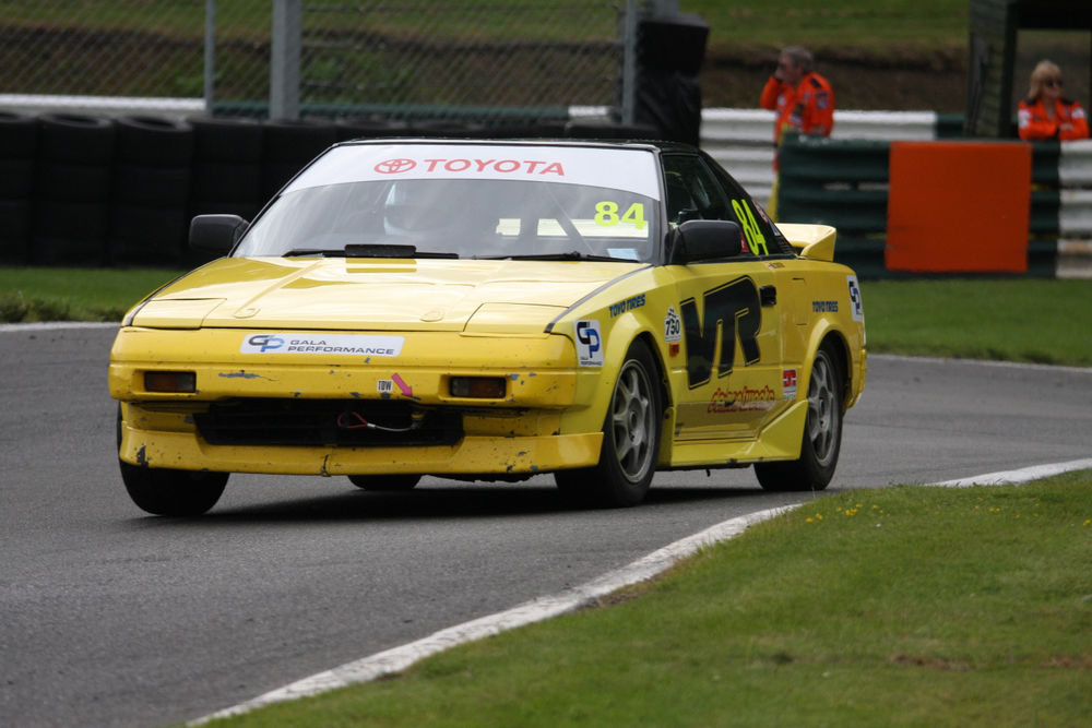 A yellow Mk1 Toyota MR2 racing in the Gala Performance MR2 Championship